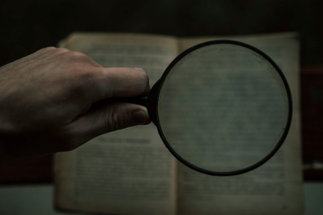 detective reading case files